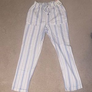 NEVER WORN: blue and white striped pants.